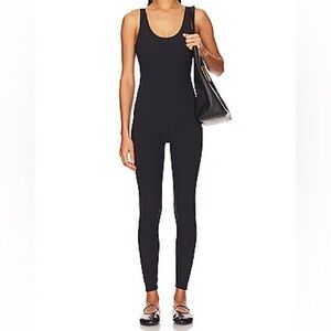 We wore what black scoop neck tank jumpsuit